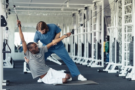 Injured worker exercising during rehabilitation